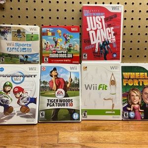 Wii Sports, Fit, Just Dance, Tiger Woods, Mario Bros, Mario Kart, Wheel Fortune